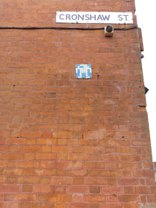 This Berzerk robot is close to a bus stop on the A6 outside Stockport.
